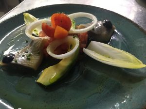 Ensalada de arenques marinados